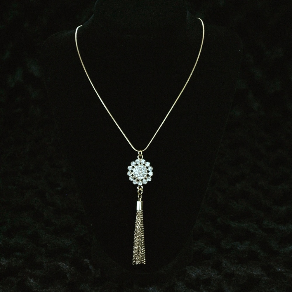 Gold-colored jeweled necklace